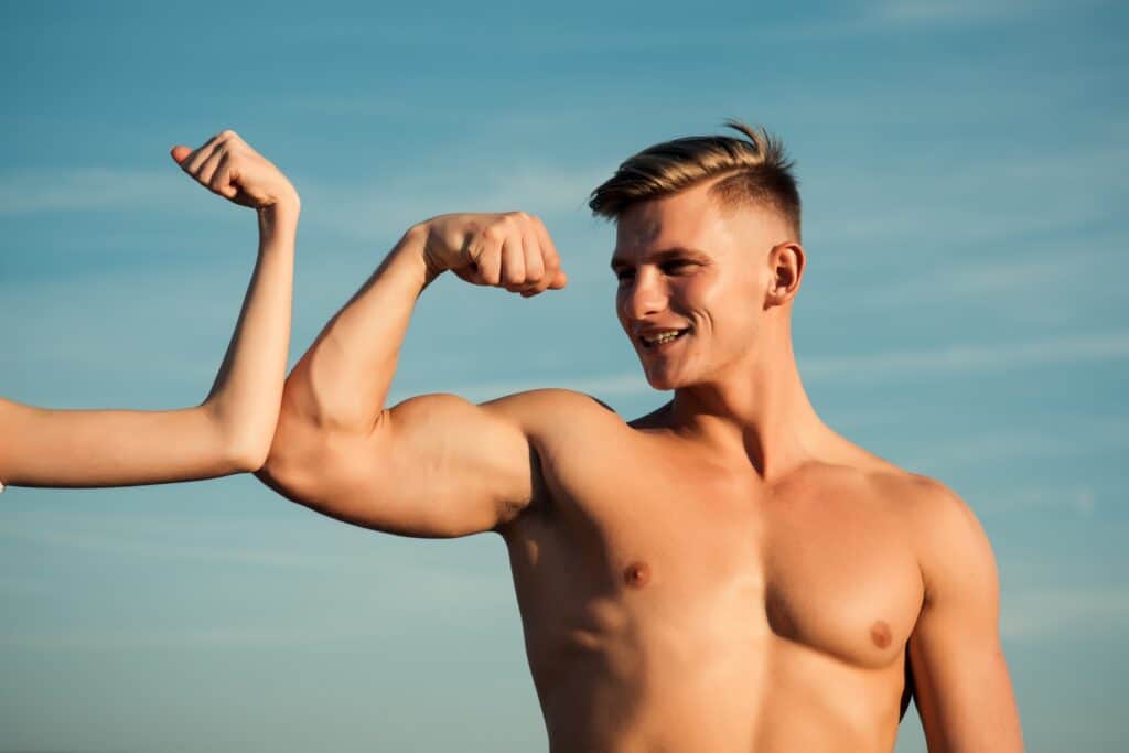 Man tensing his bicep.